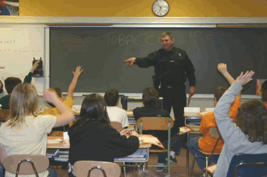 Officer Steven Havens of the Oneonta (NY) Police Department teaching students the D.A.R.E. program
